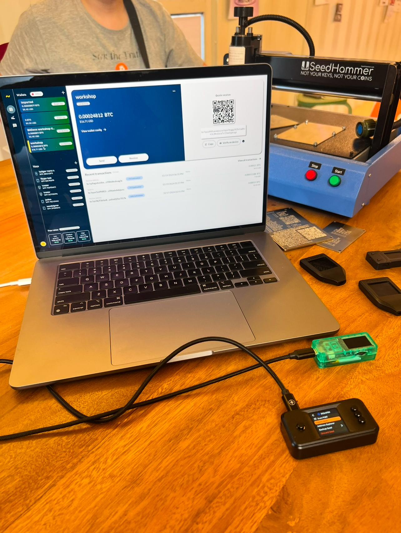 Bitcoin hardware tools and signing devices on a table