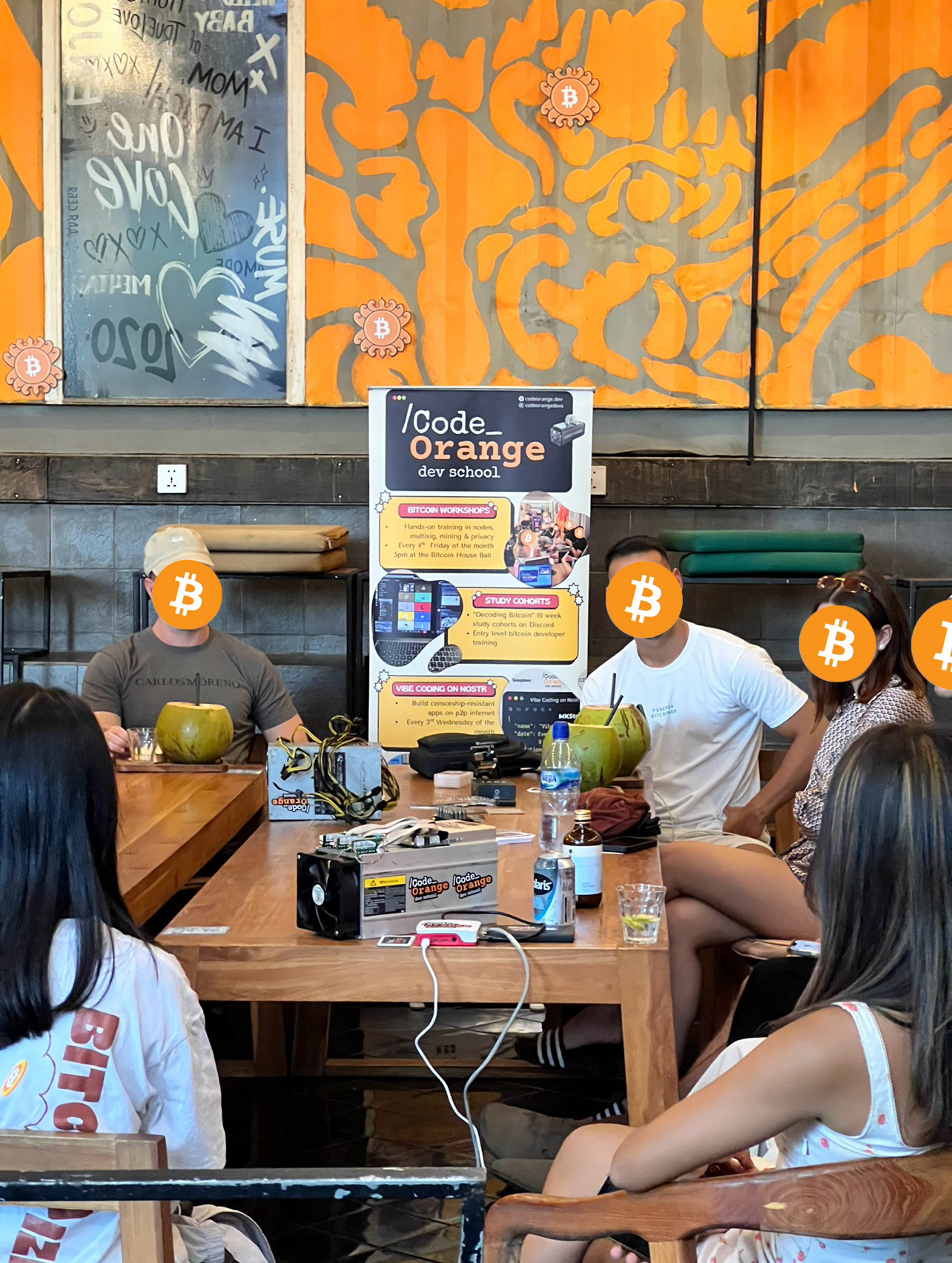 Bitcoin workshop gathering with poster and participants